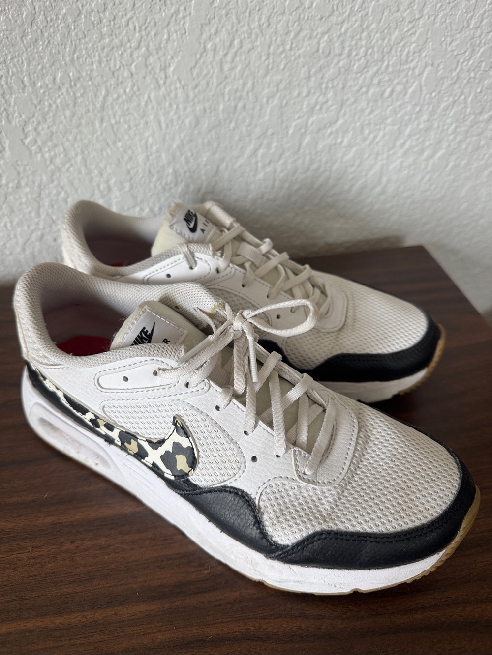 Nike Women’s White Sneakers with Black Accents and Leopard Swoosh